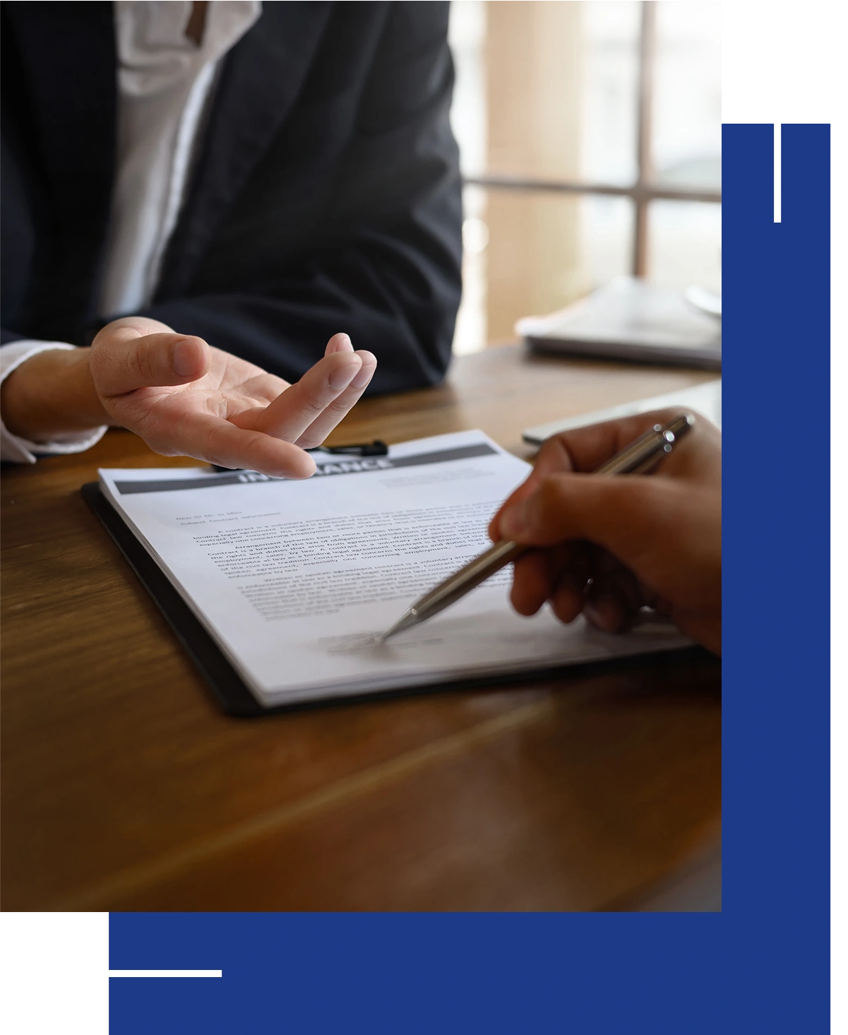 Signing document during a business meeting.