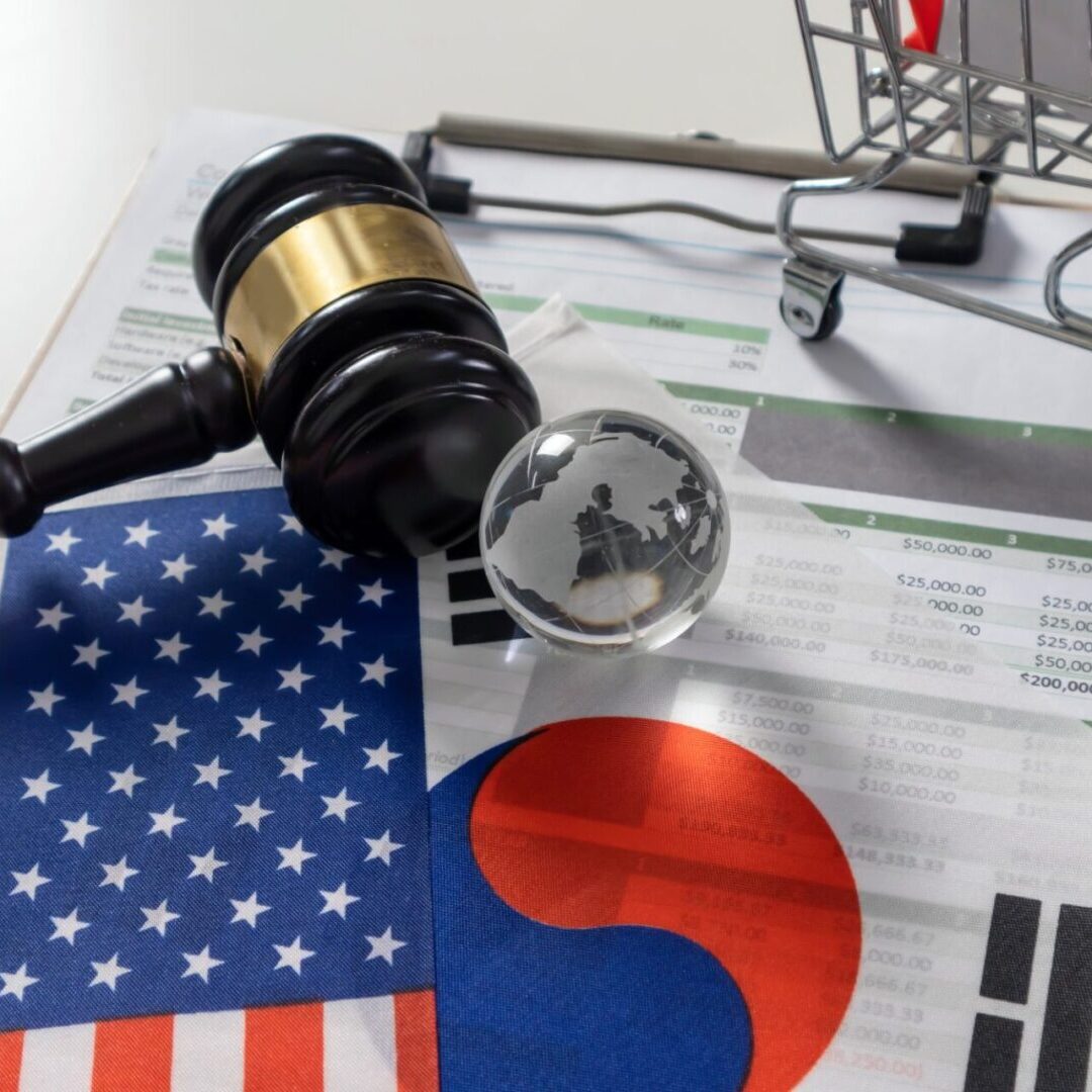 Gavel and flags on financial documents.